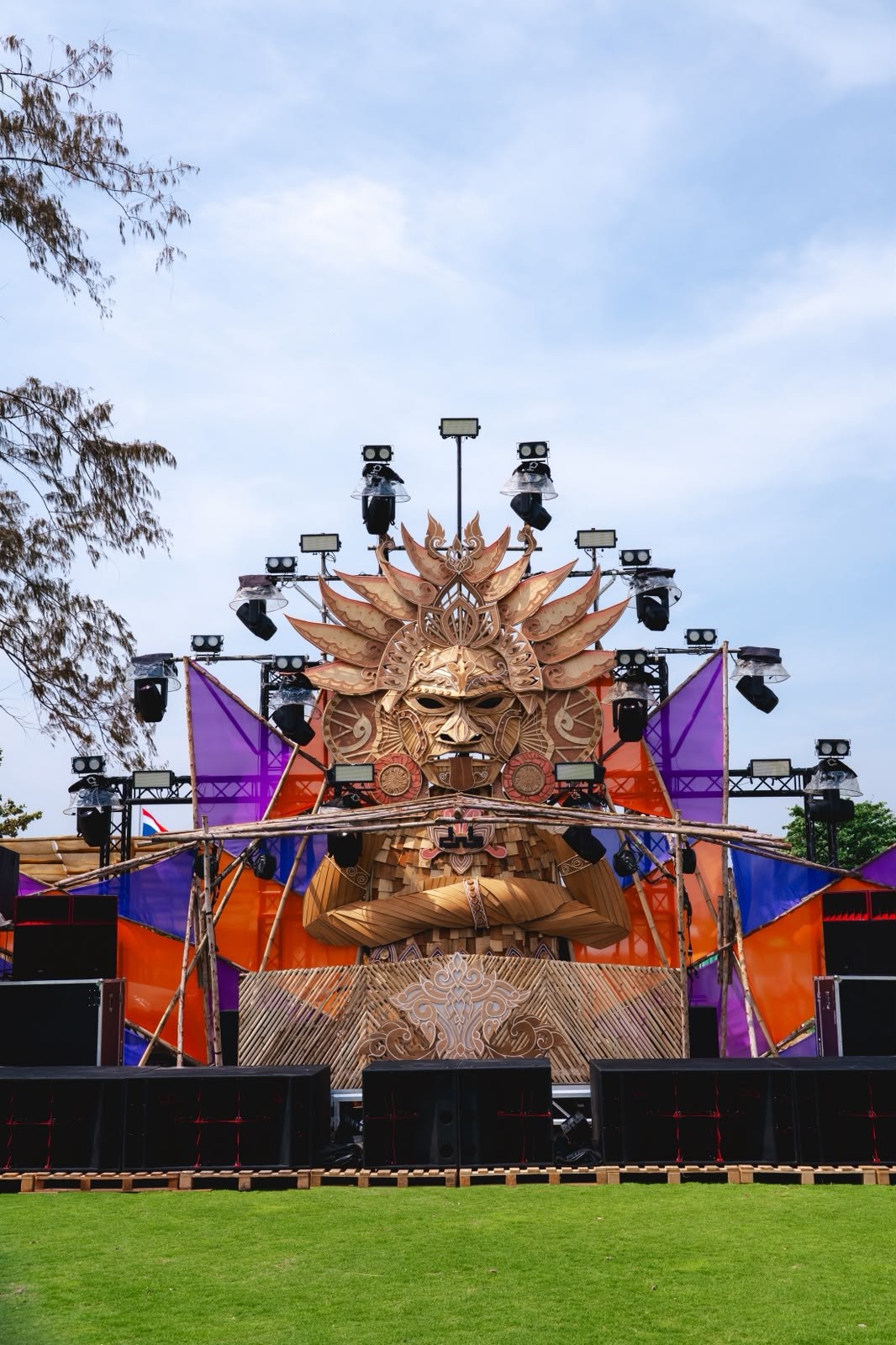 Bamboo and scaffold stage with a carved face, Thailand, January 2026